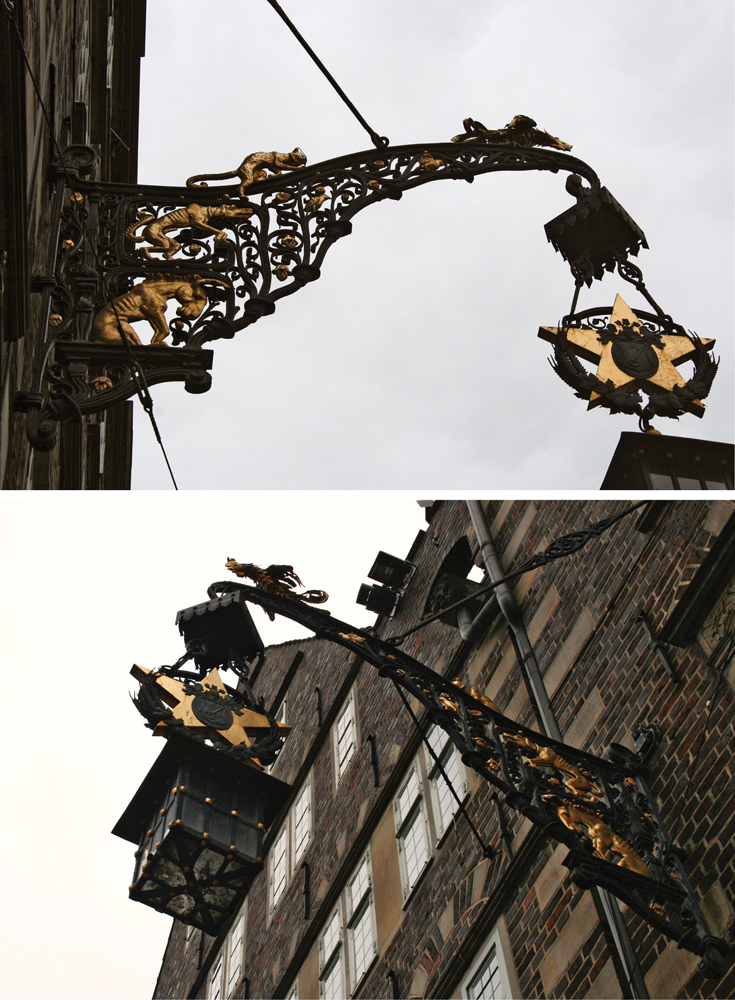 The gilded wrought iron fixture extending from the Deutsche Haus in Bremen, Germany, featuring the Bremen Town Musicians.