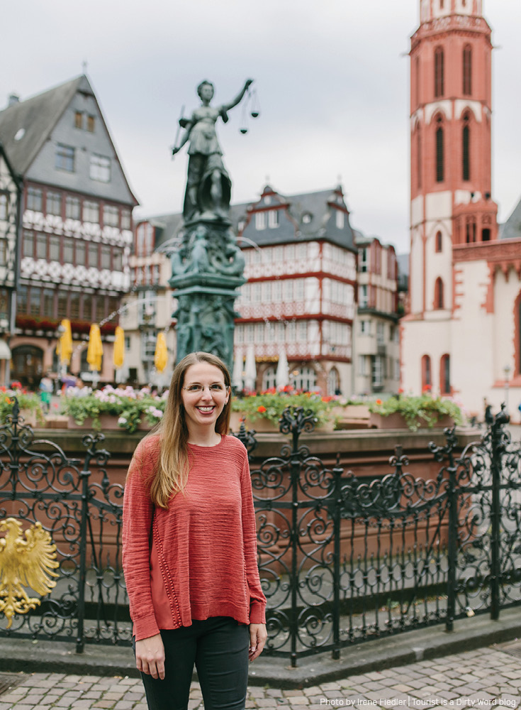 Exploring the Römer in Frankfurt am Main, Justice Fountain in the background | Photo by Irene Fiedler for Tourist is a Dirty Word Blog