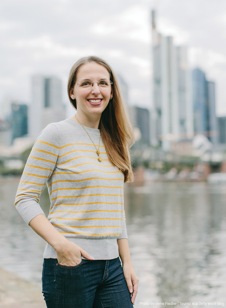 Posing with the 'Mainhattan' skyline of Frankfurt am Main blurred in the background | Photo by Irene Fiedler for Tourist is a Dirty Word Blog