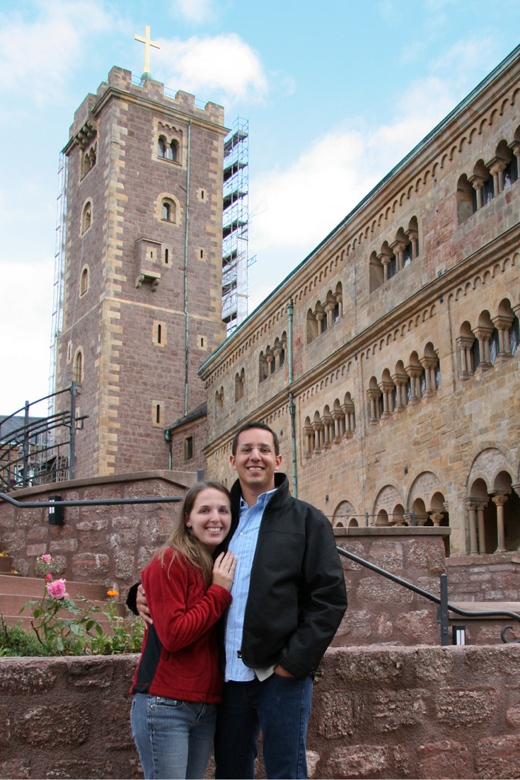 Standing in front of the cistern and bergfried in Wartburg Castle, Germany